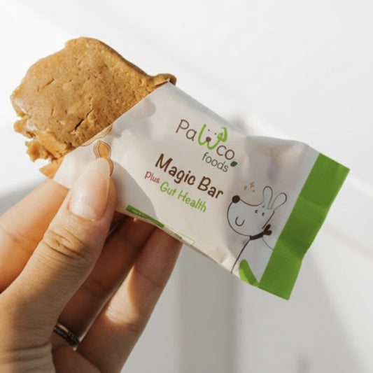 PawCo Magic Bar Gut Health – half-unwrapped bar held in hand, showing inside – PawCo Foods
