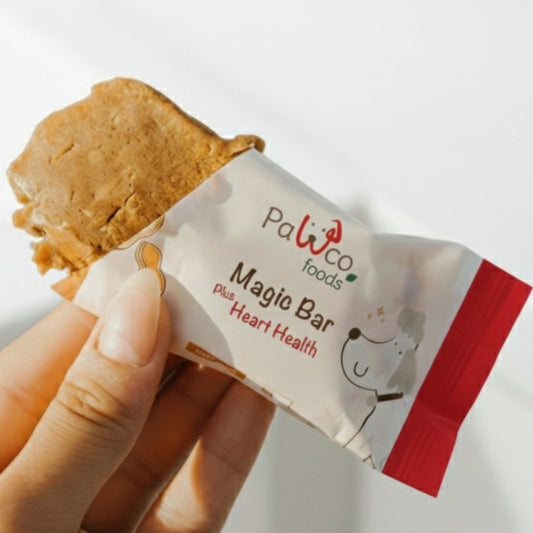 PawCo Magic Bar Heart Health – half-unwrapped bar held in hand, showing inside – PawCo Foods